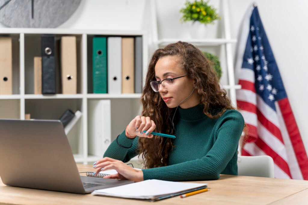 medium shot girl with laptop headphones studying