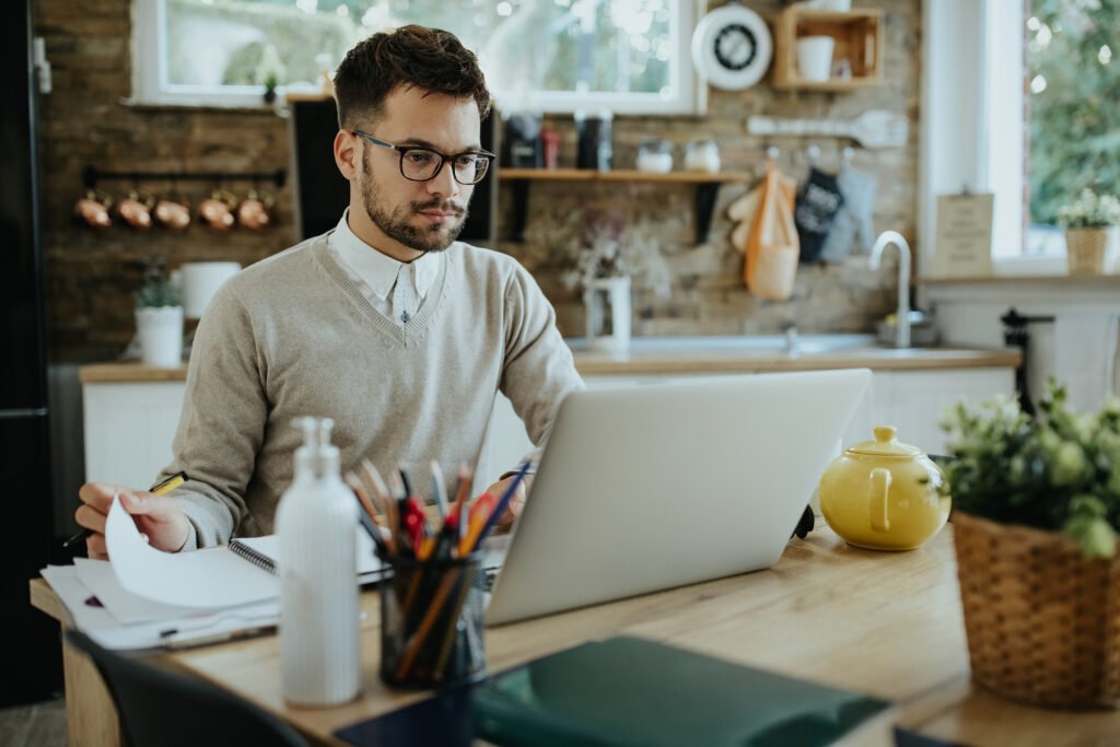 young entrepreneur using laptop while working at home.