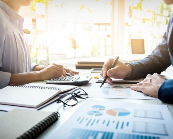 business man financial inspector and secretary making report, ca