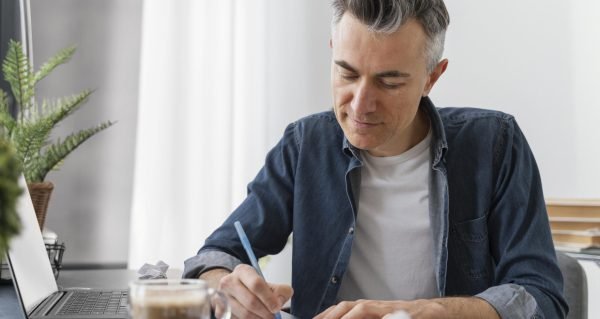 portrait man writing letter